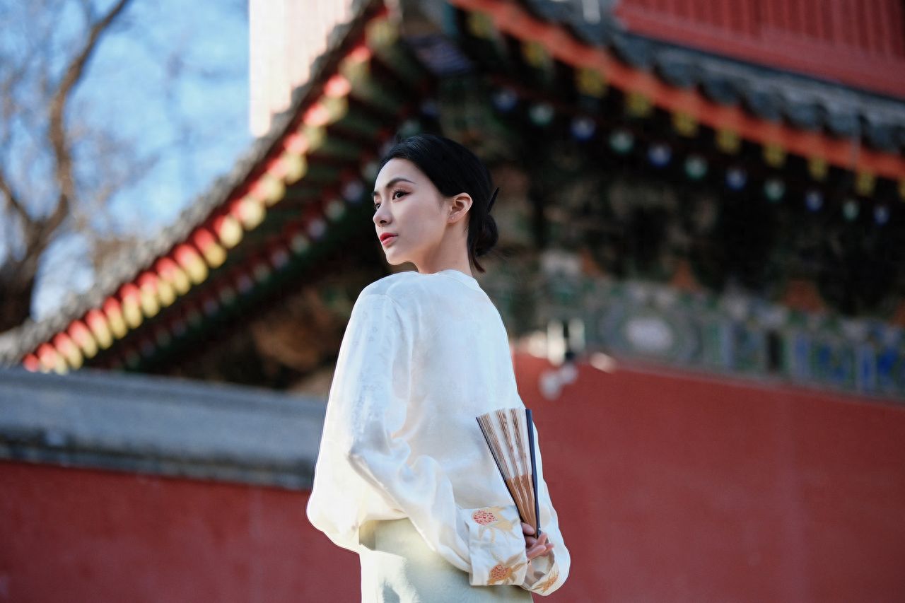 Photo by Beijing Wanshou Temple - Taking a photo with the red walls and temple architecture.