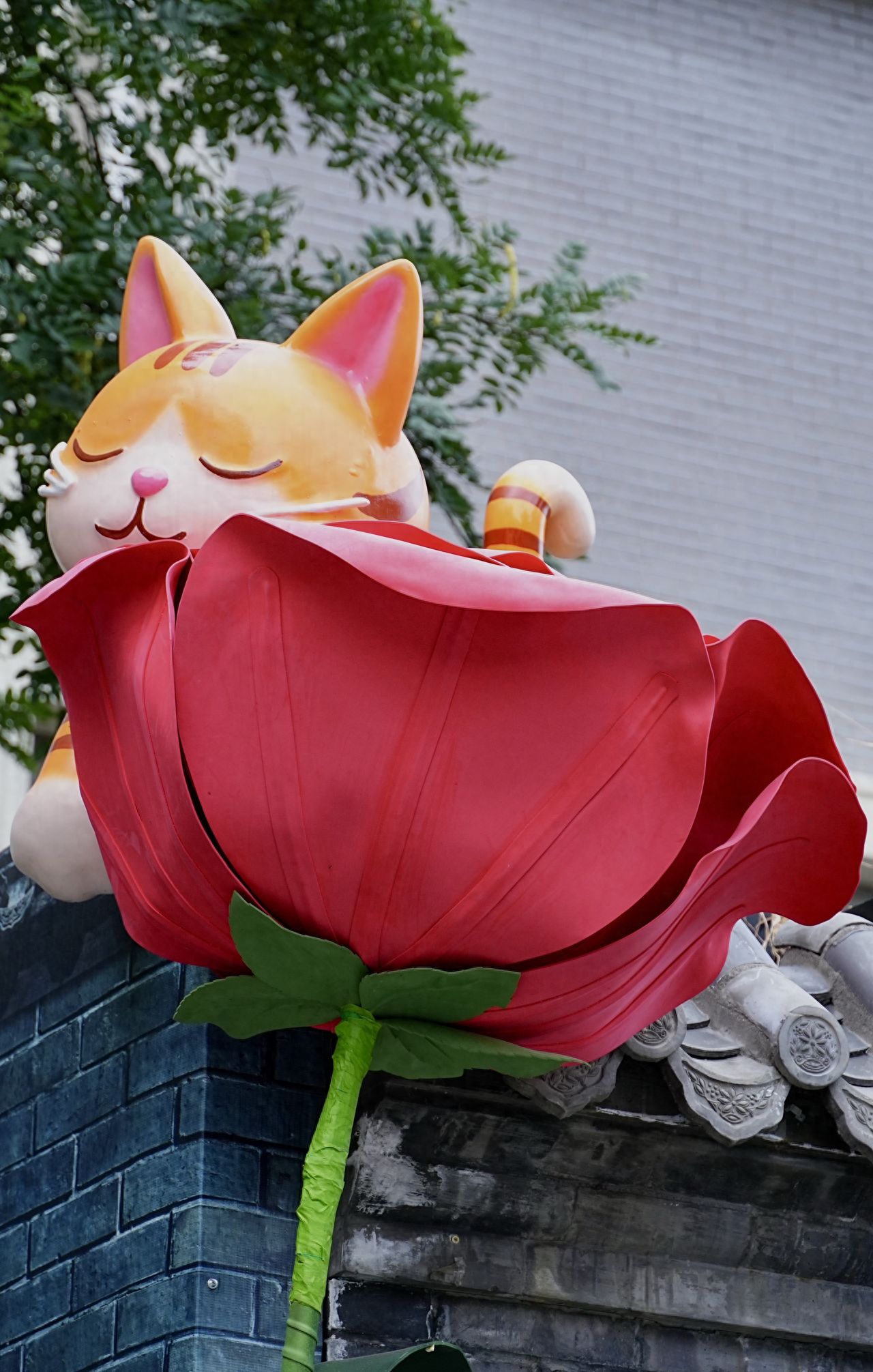 Photo by Romantic Hutong - Cat and Flower Installations and Brick Walls