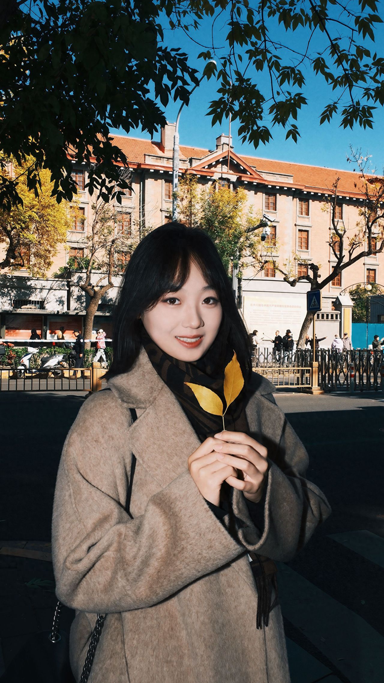 Photo by Beijing May 4th Street - Take a photo with the Red Building architecture and foliage.