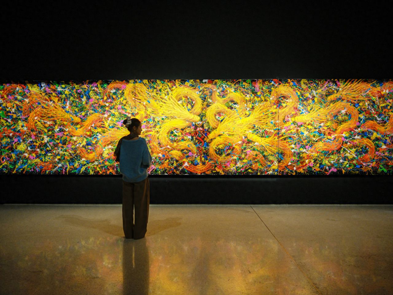 Photo by In front of the huge dragon painting at Beijing Times Art Museum.