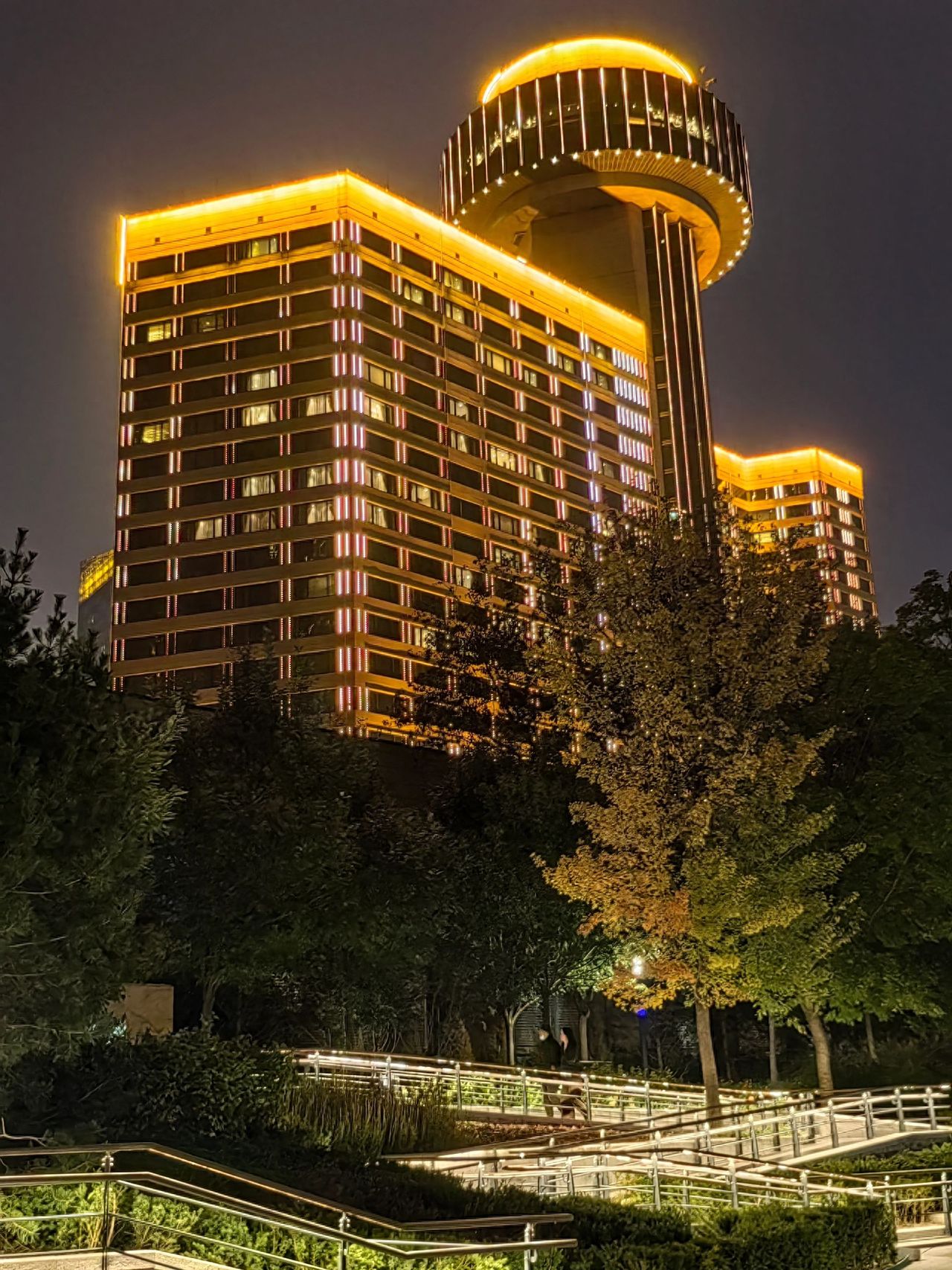 Photo by Liangma River - Nighttime photography of high-rise building walkways