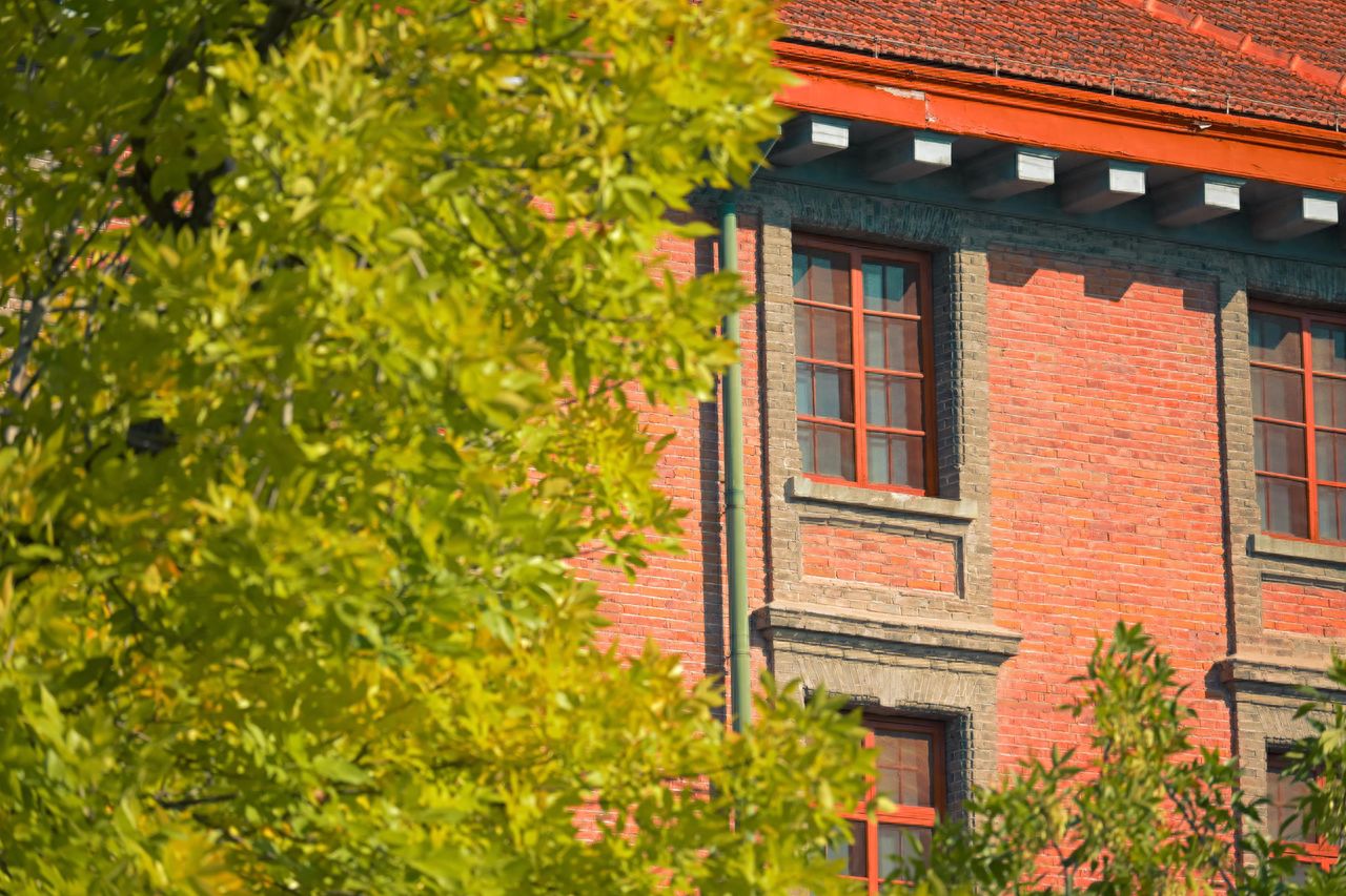 Photo by Beijing May 4th Street = Red Buildings and Trees