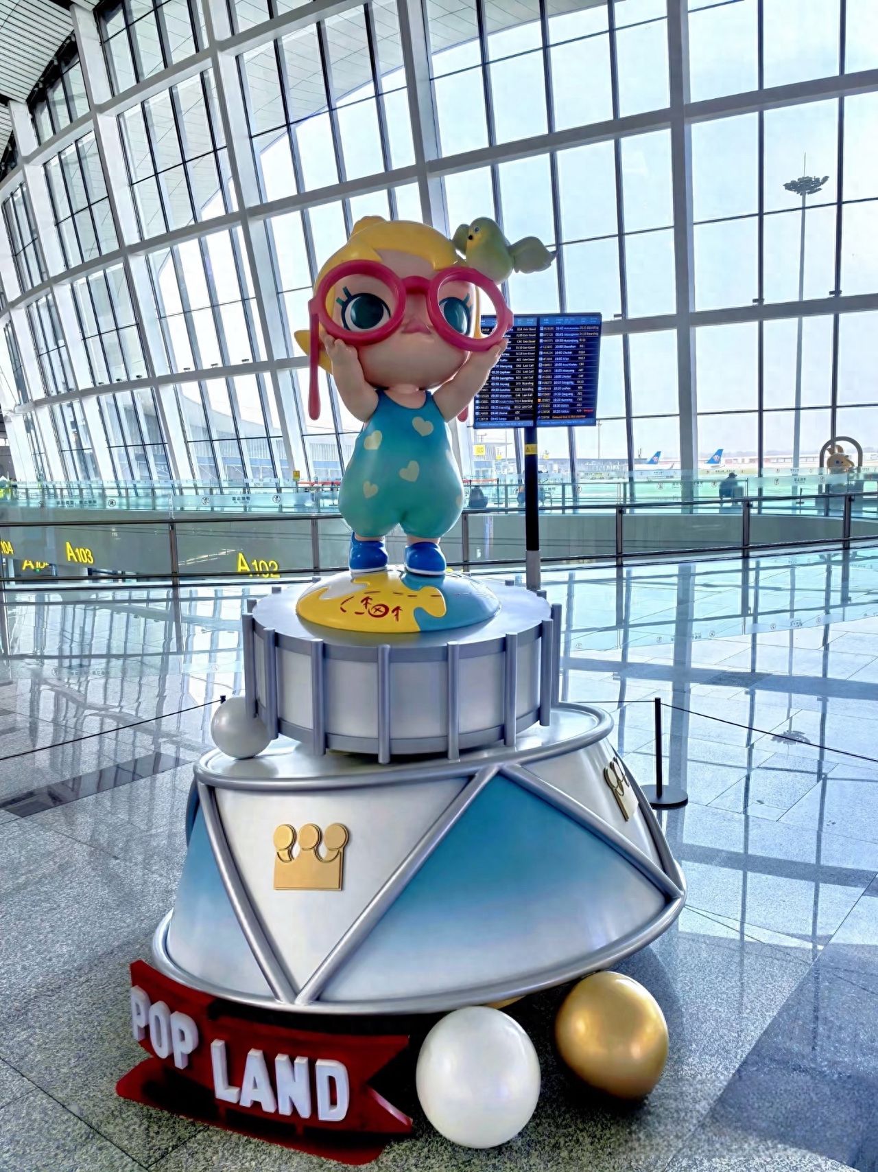 Beijing Daxing Airport - Little Girl Cartoon Character Mascot Installation — photo spot in Beijing Daxing International Airport  , China