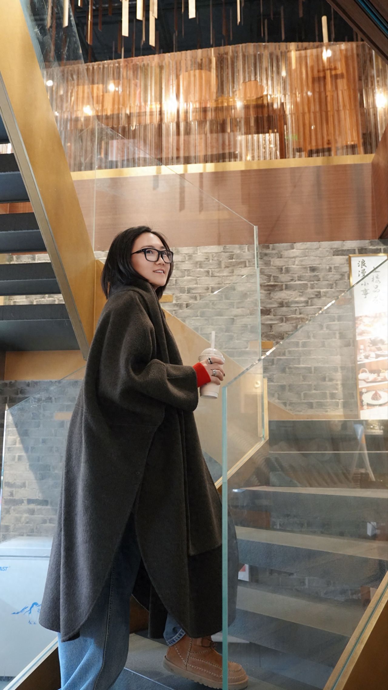 Photo by Beijing May 4th Street - Take a photo with the indoor glass guardrail staircase.