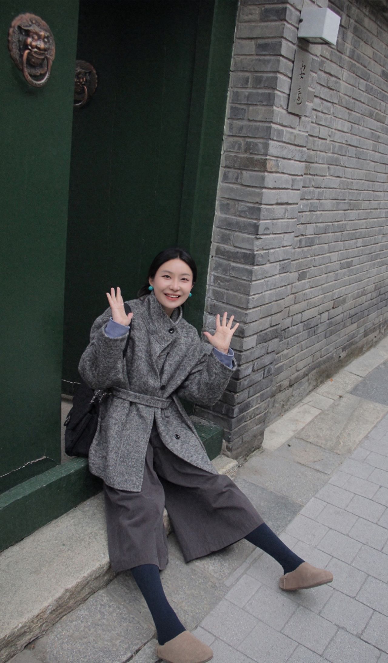 Qianmen Street in Beijing - Take a photo with the brick wall and green gate. — photo spot in Qianmen Street, China