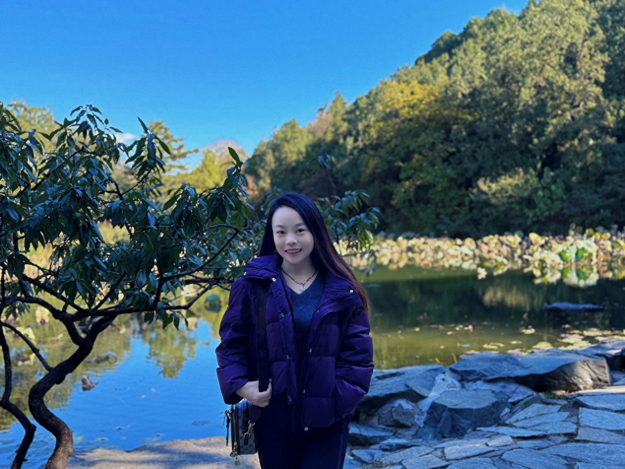 Photo by Beijing Xiangshan Park - Take a photo with water pools, rocks, trees, and lake views amidst the forested mountains.