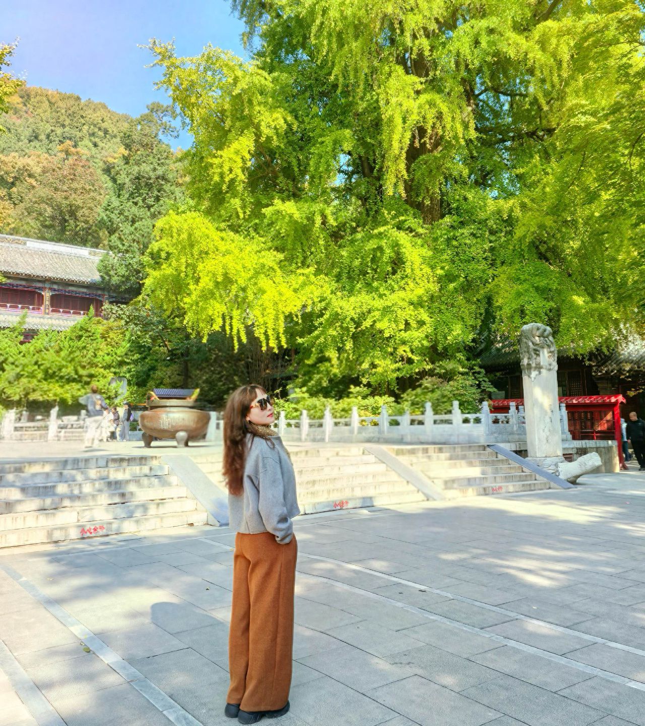 Photo by Tanzhe Temple - Take a photo with the ancient ginkgo tree and the incense burner stone stele.