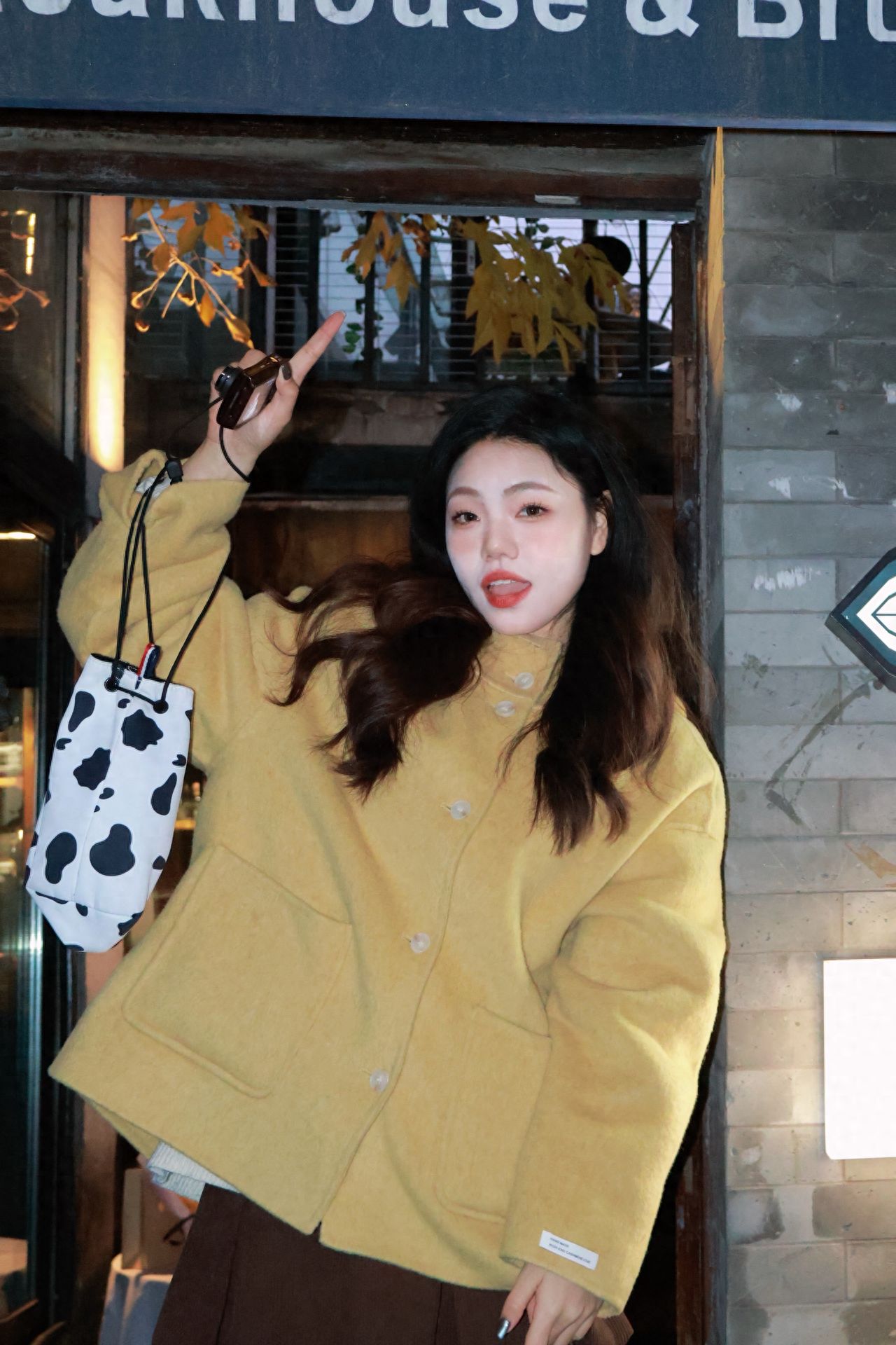 Photo by Beijing May 4th Street - Take a photo with the shop's window and signboard at the entrance.