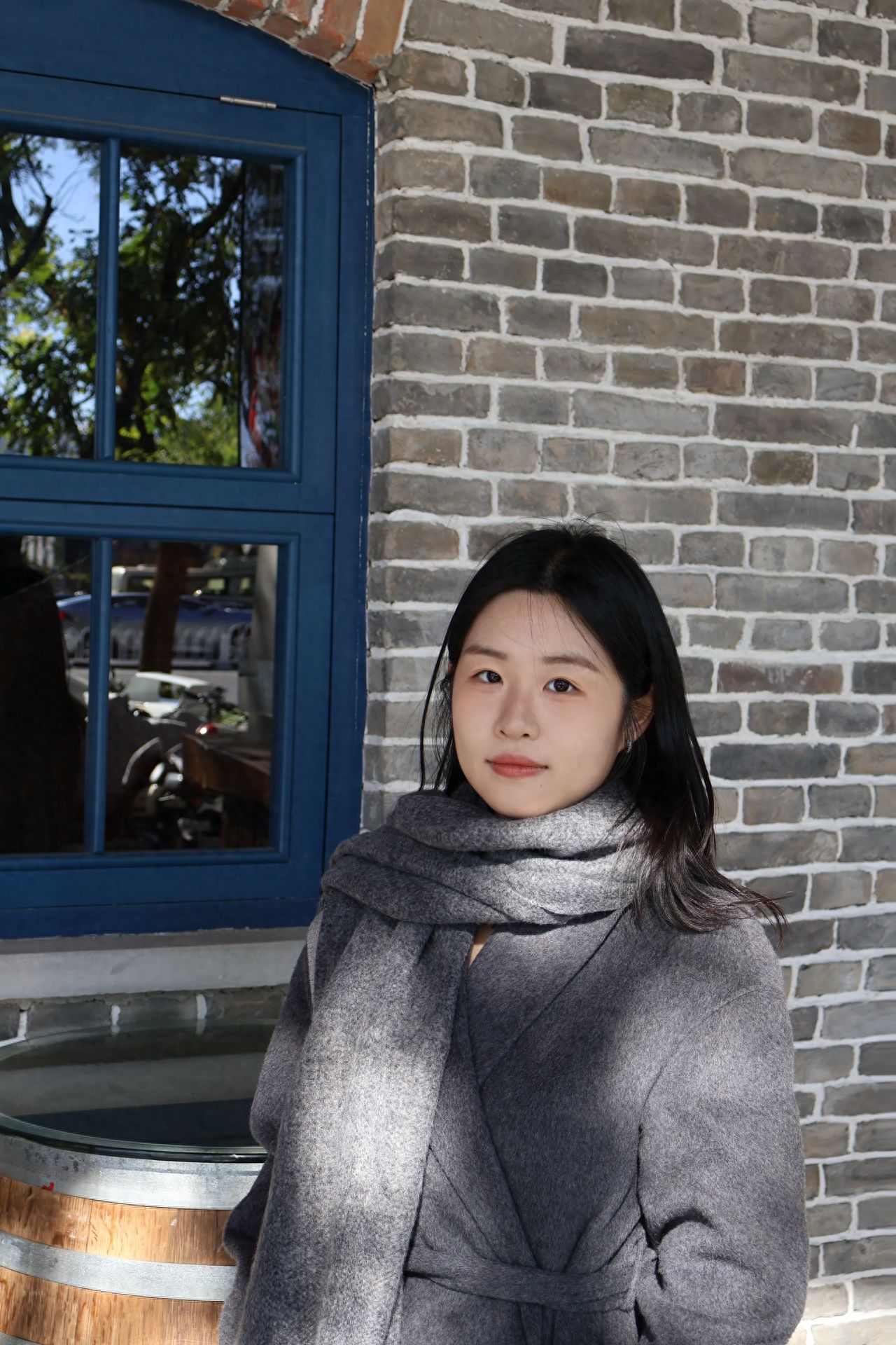 Photo by Beijing May 4th Street - Group photo with brick walls and blue window frame windows