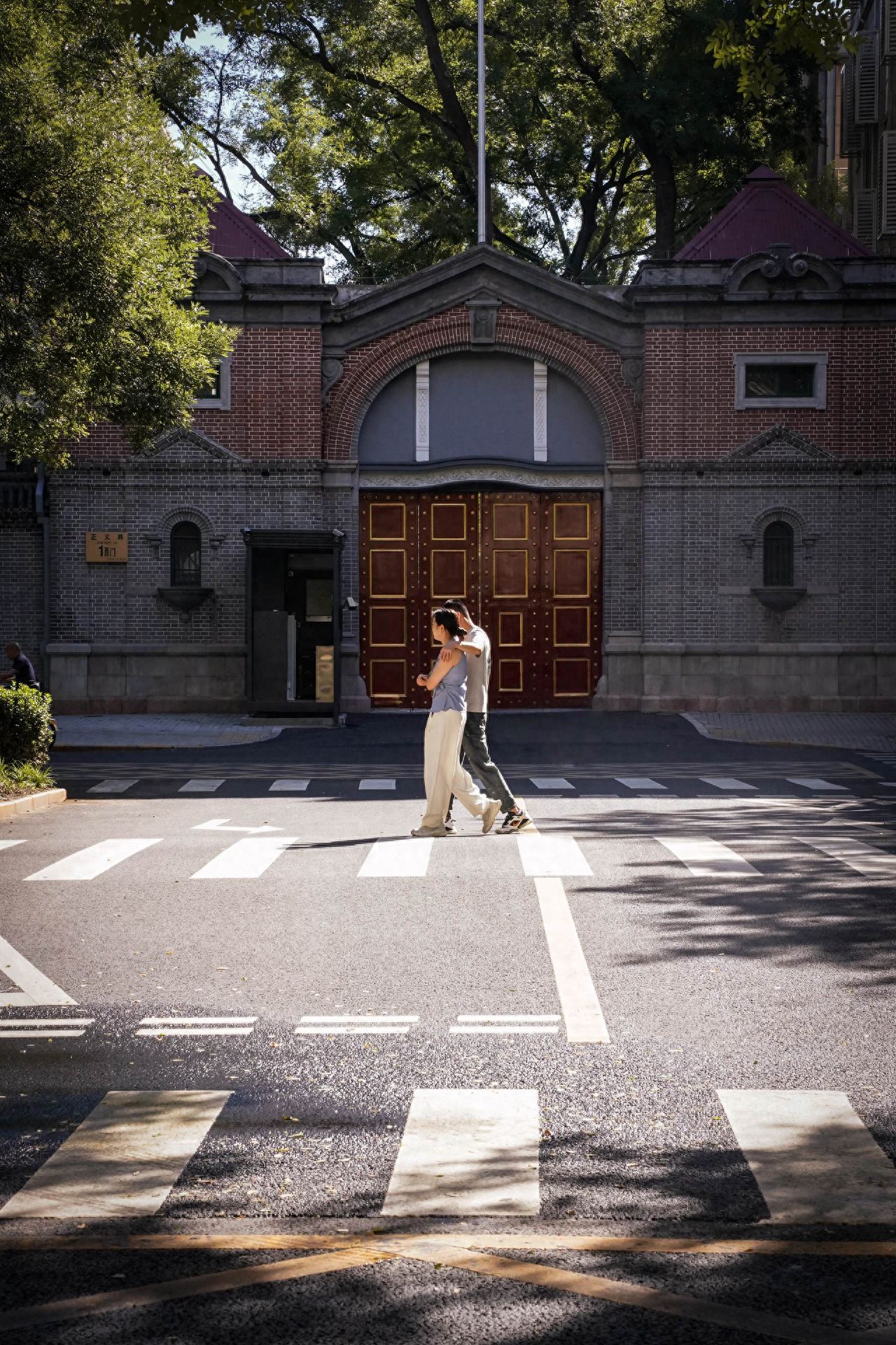 Photo by Dongjiaomin Alley – Street Crosswalk and European-Style Building Entrance