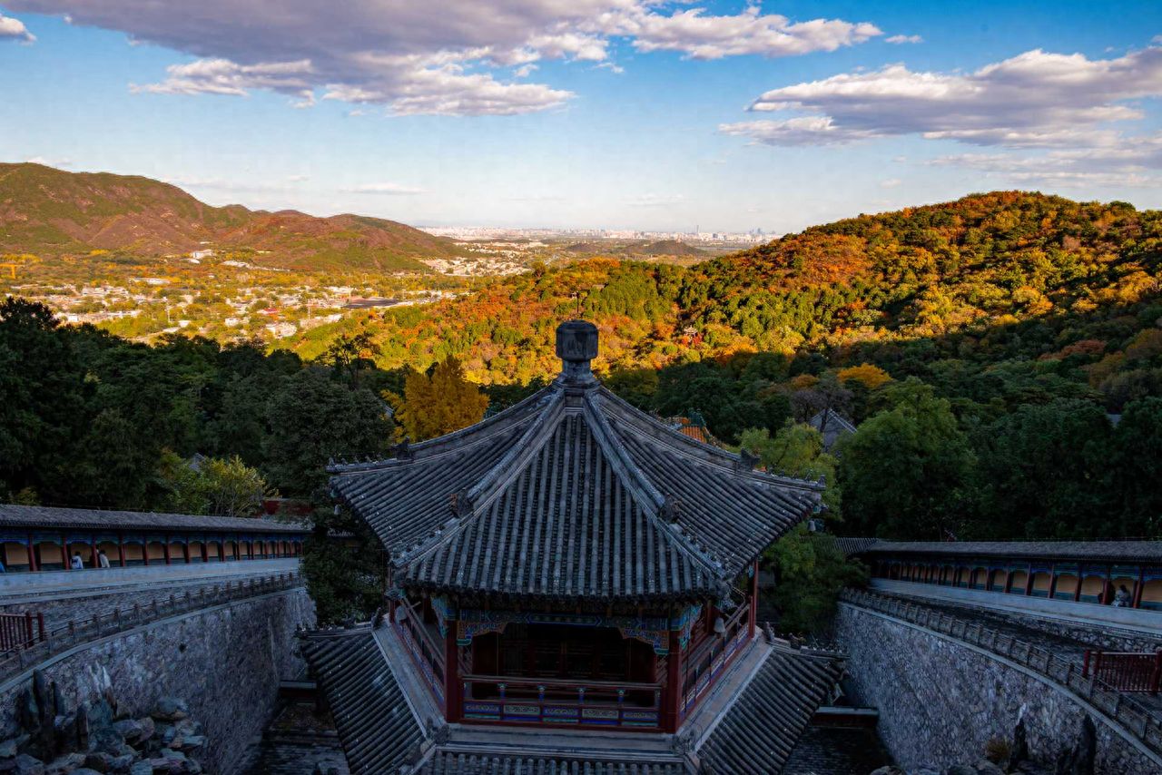 Photo by Beijing Fragrant Hills Park - capturing ancient architectural rooftops and autumn forest mountain views
