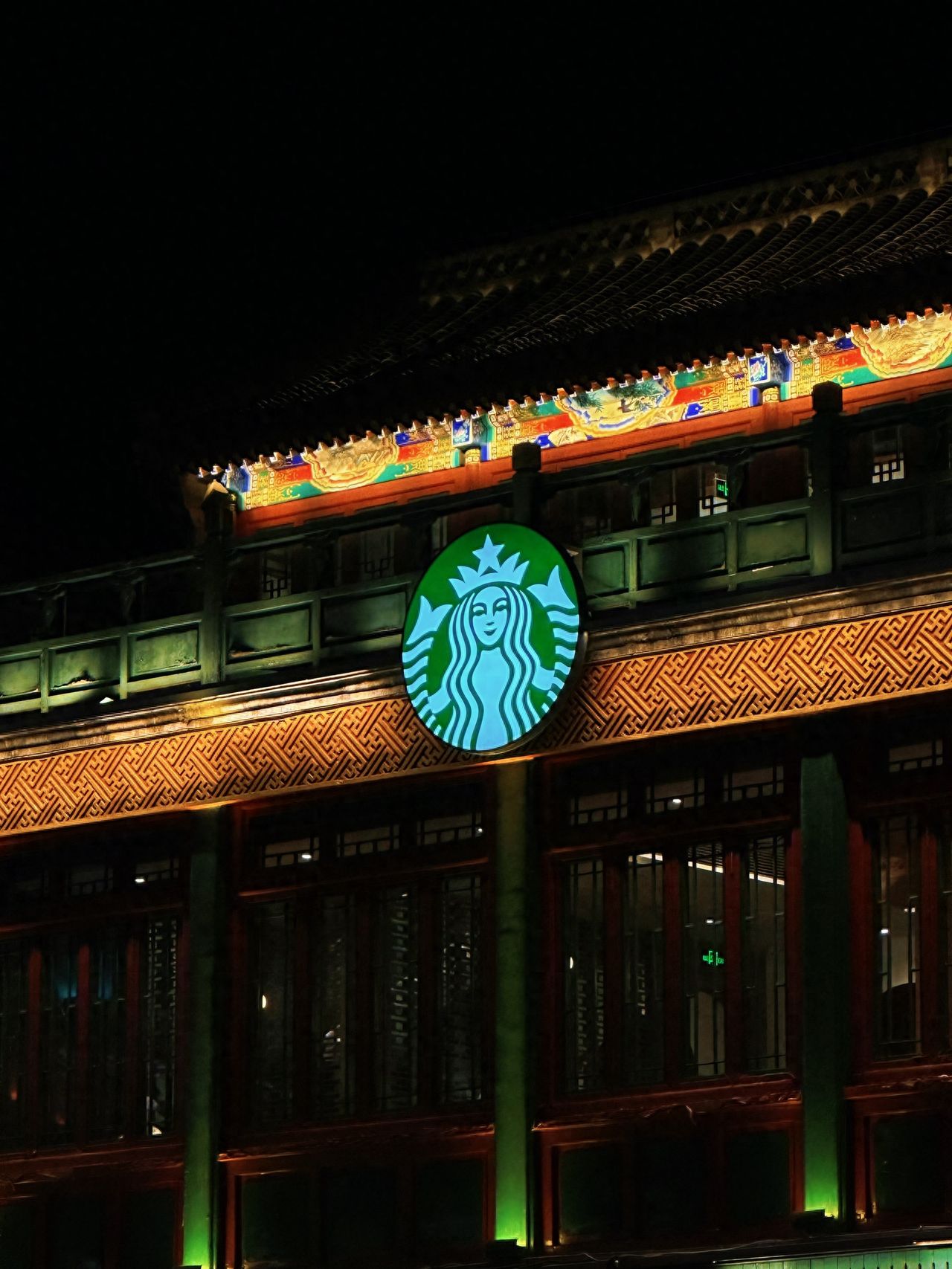 Photo by Starbucks (Qianmen Street, Beijing) - Starbucks sign at night