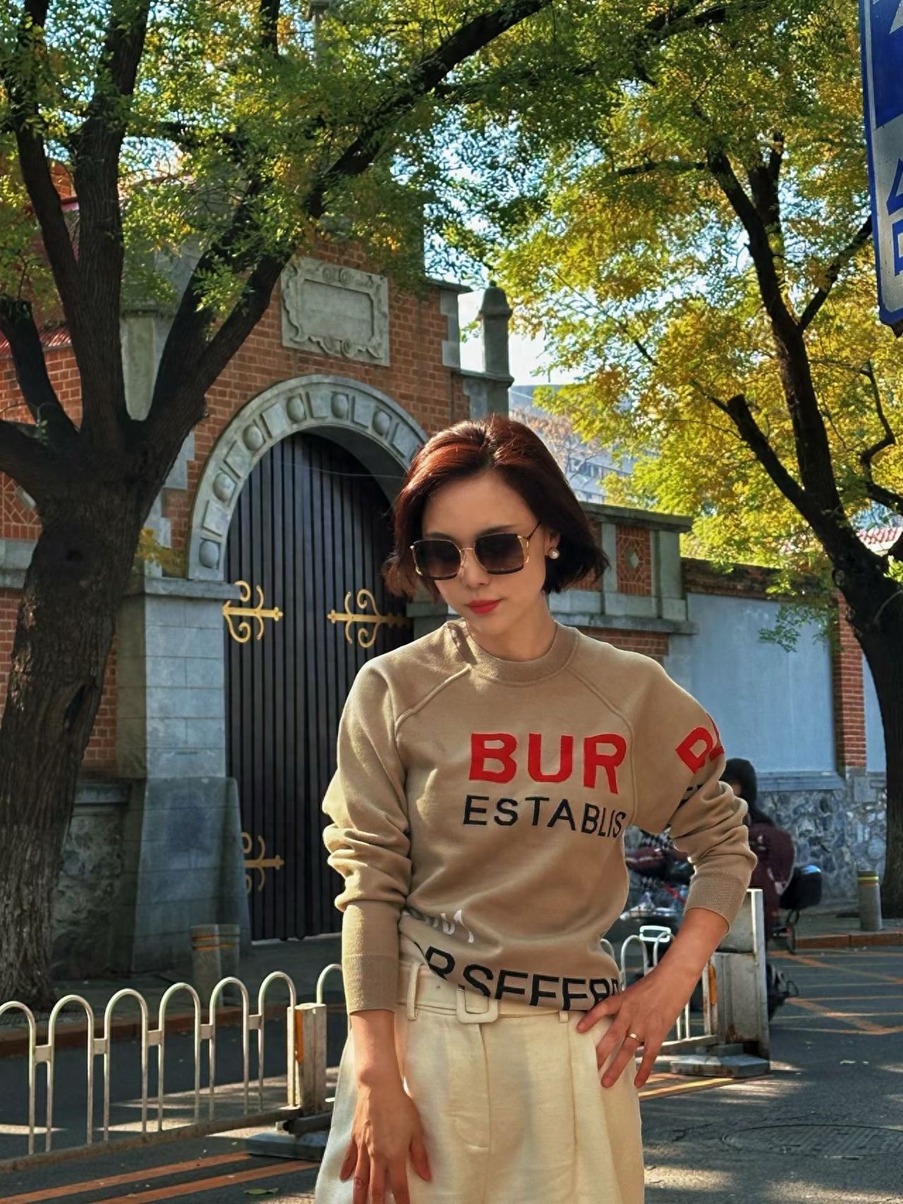 Photo by Dongjiaomin Alley – Photo with Red Brick Arch Building and Trees