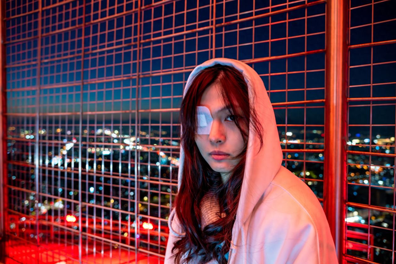 Photo by Central TV Tower - Taking a Picture with the City Night View against the Red Fencing