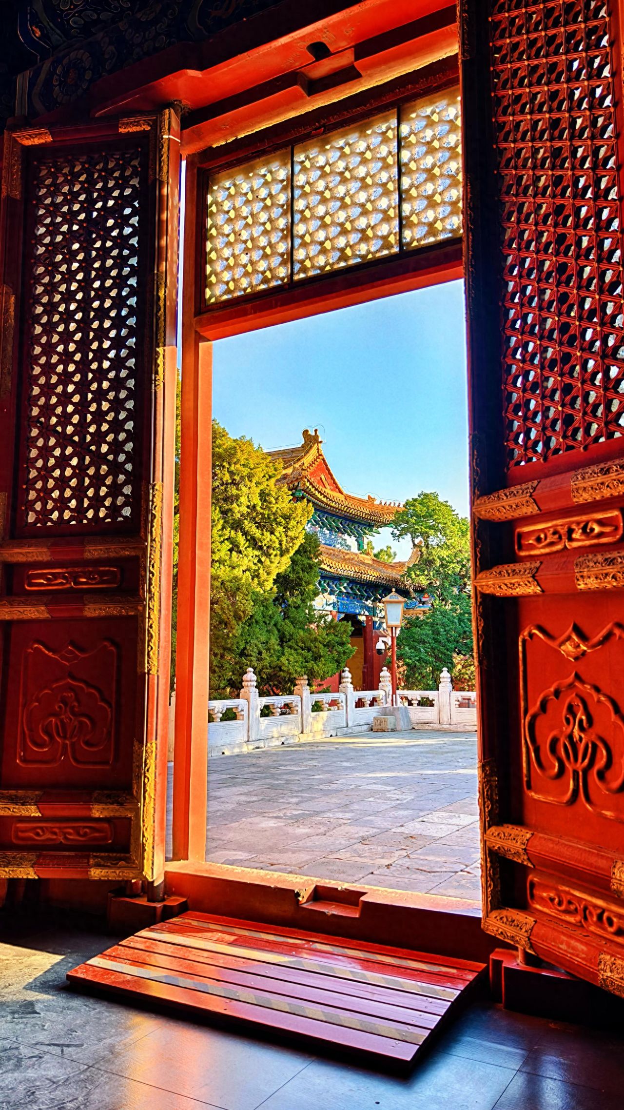 Photo by Confucius Temple and the Imperial Academy Museum - Capture the ancient architecture through the doorway frame.