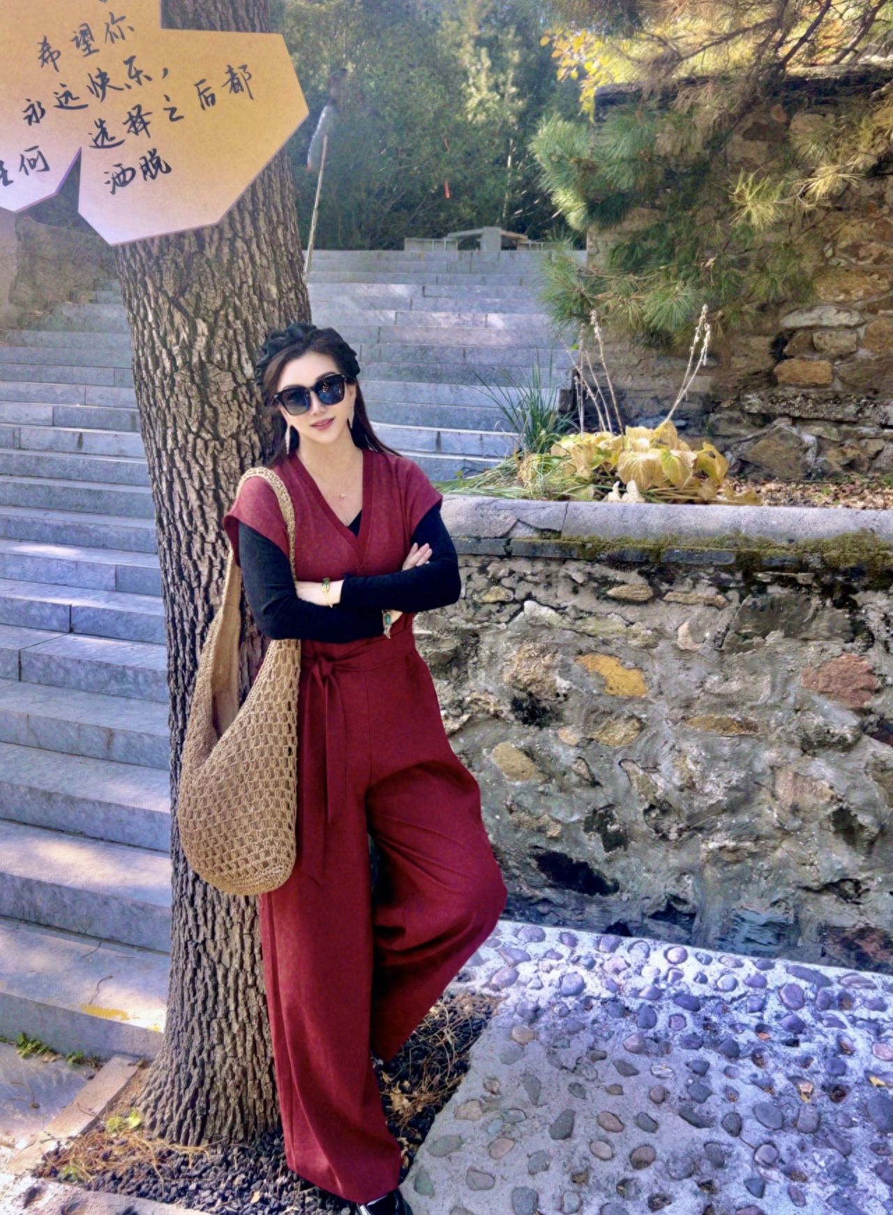 Photo by Tanzhe Temple - Take a photo with trees, stone walls, and green plants on stone steps.