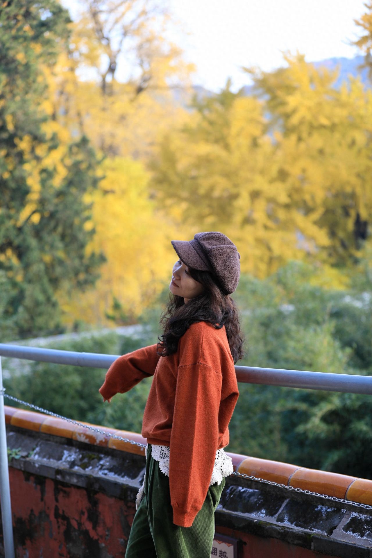 Photo by Tanzhe Temple - Take a photo with the railings, architecture, and trees.