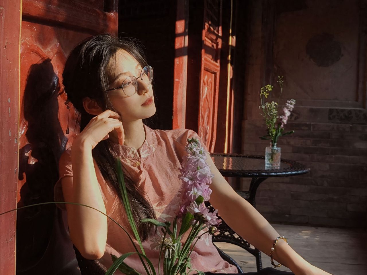 Photo by In front of the red wall at the Magnolia Tea House of Tanzhe Temple in Beijing.