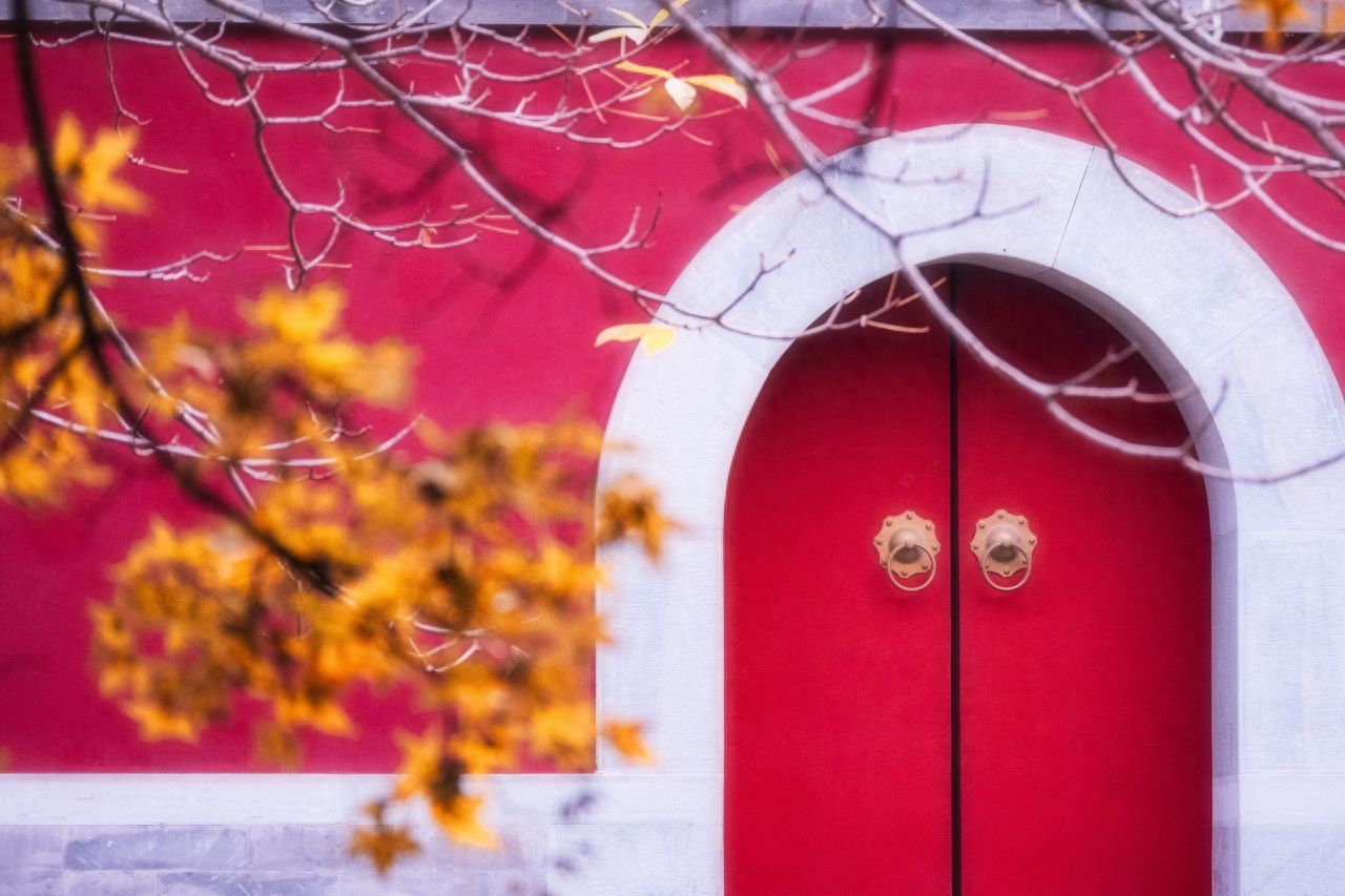 Photo by Fragrance Hill Park - Red Wall Archways and Autumn Leaves