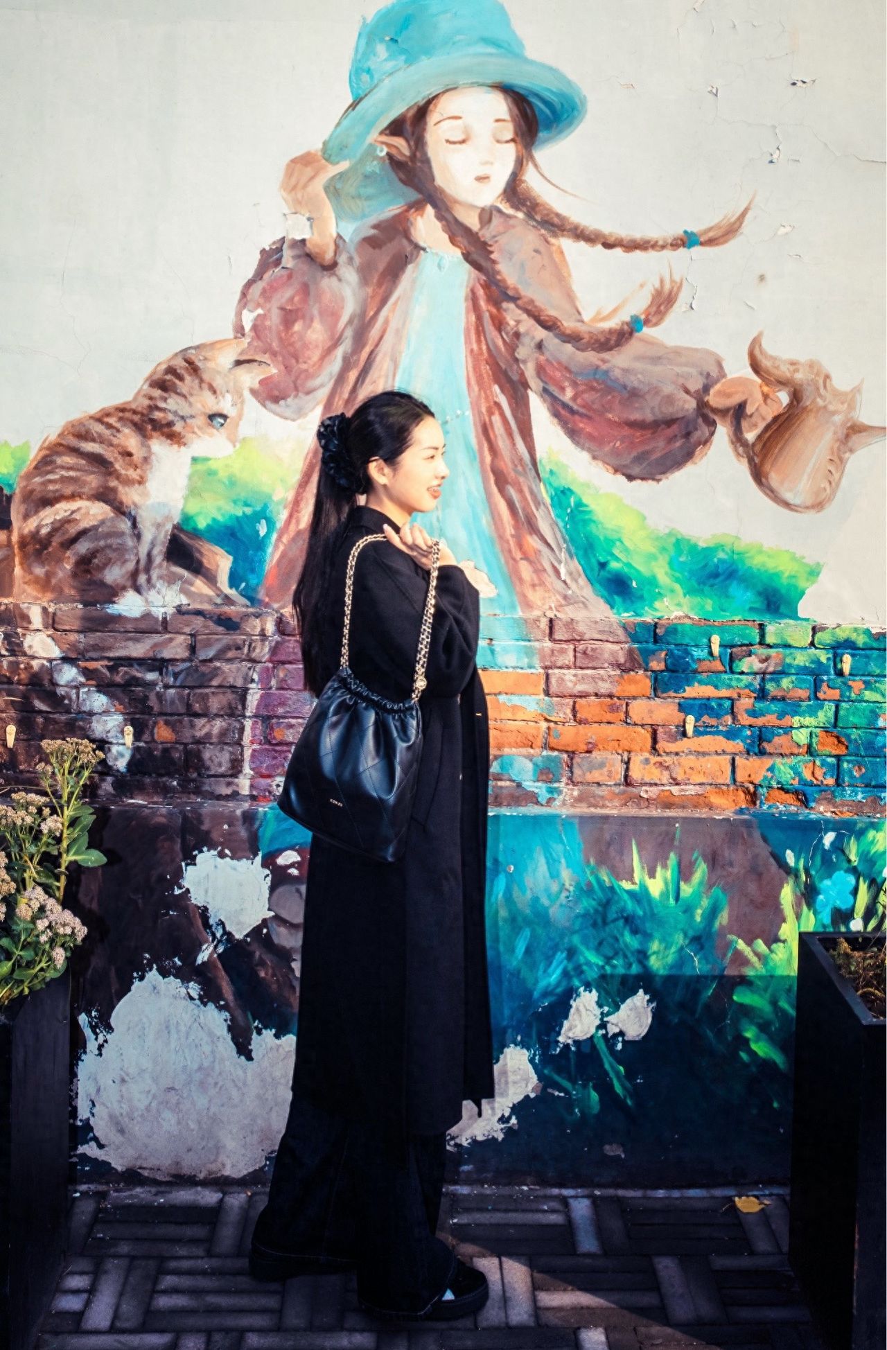 Photo by Nanman Hutong - Take a photo with the girl graffiti wall.